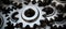 Close up of shiny silver metallic engine gear wheels on industrial background with copy space