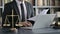 Close up Shoot of Lawyer Hand making Notes with Laptop in Court Room