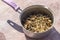 Close-up shoot of string beans dried under the sunlight in cooking pot