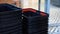 Close-up of a shopper's male hand lining up an empty grocery cart in a supermarket or grocery store