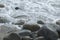 Close Up Shore With Clear Water And Rocks