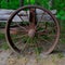 Close-up shot of an abandoned rusty metallic wheel