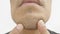 Close-up shot of a bearded Asian\\\'s face.