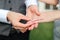 Close up shot of beauty groom hand with beautiful wedding ring hugging her husband young groom with love during pre wedding photo