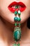 Close up shot of bijouterie of green stone necklace in female l