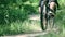 Close-up shot of bikes riding on park trail