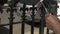 A close up shot of a black contractor painting metal railings at the front of a house