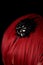 Close-up shot of black hair fascinator on red hair