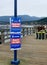 Close up shot of blue and red Social distance signs for Covid 19 at the Pier of Rocky Point Park in Port Moody, October 1st 2020