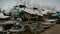 Close up shot of the broken cars that are on the landfill of vehicles, rusted and broken cars are waiting for the