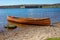 Close-up shot of a canoe boat parked by a shore