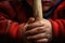 a close-up shot of a childs hands gripping a t-ball bat