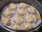 Close up shot of a Chinese style pork Xiao Long Bao