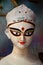 Close up shot of clay idol of Goddess Devi Durga, before upcoming Durga Puja at a potter`s studio in Kolkata