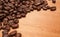 Close up shot of coffee beans on wooden board