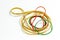 Close-up shot of colorful rubber band with blurry white background