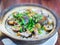 Close up shot of cooking the traditional eel fish claypot rice