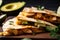 close-up shot of a crispy chicken quesadilla garnished with sliced avocado, cilantro, and jalapeno peppers