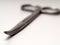 Close up shot of curved stainless steel medical scissor