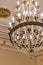 Close up shot of the decorative walls, ceiling and chandelier. Interior