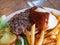 Close up shot of delicious Bison Burger with french fries and salad