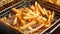 Close up shot of delicious golden crispy french fries being cooked in a deep fryer
