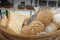 Close-up shot of different breads in a wicker basket.