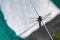 Close-up shot of a dragonfly over rope on a tent in a forest camping