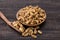 Close up shot of dried white mulberries fruits in a wooden bowl