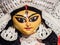 Close up shot of face of an Idol of godess durga mata with beautiful eyes and beautiful facial features