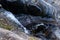 Close up shot of a falling water creek in Penha Garcia, Protugal