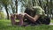 Close up shot of a flexible woman stretching at park and doing yoga