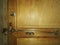 Close up shot of French old metal lock and key on wooden door