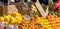 Close-up shot of fresh citrus fruits in an open-air market