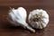 Close up shot of fresh garlic in a blurry background of a wooden table