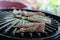 Close-up shot of fresh pork grilled on an electric stovetop, electric pan, popular Asian grill food concept.