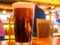 Close up shot of a glass of dark lager beer