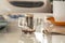 Close-up shot of a glass with fresh instant brew drip coffee bag on a table