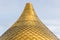 Close up shot of a golden dome of a church, cathedral or mosque bulbs shape on the blue sky . Background metal yellow rectangle pa