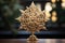 close-up shot of a golden star tree topper, positioned at the peak of a Christmas tree