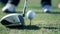 Close up shot of a golfers walk towards a point where he sticks a white golf