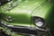 Close up shot of a green colored Chevrolet brand classic cars headlight at the exhibition of classic cars Izmir fair