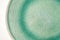 Close up shot of green porcelain texture of the plate.