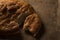 Close up shot of a hand divided Ramadan pita bread on a jute background