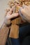 Close-up shot of the hands of an artisan carving on a wooden statue