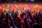 A close-up shot of hands holding glow sticks in the air at a rave party with a blurry crowd of people dancing in the background.