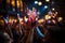 A close-up shot of hands holding glow sticks in the air at a rave party with a blurry crowd of people dancing in the background.