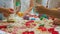 Close-up shot on hands of little children playing with colorful toys and sand in nursery. Multiethnic multiracial
