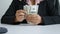 Close up shot hands of woman counting dollar bill banknote