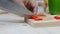 Close up shot Hands of woman using kitchen knife slice and cut the bell pepper
